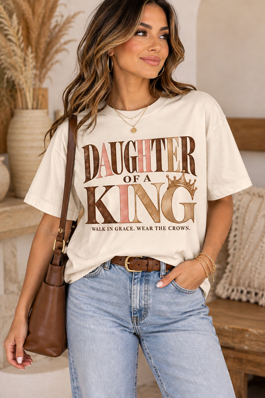 Model wearing the ivory Daughter of a King graphic tee with crown detail