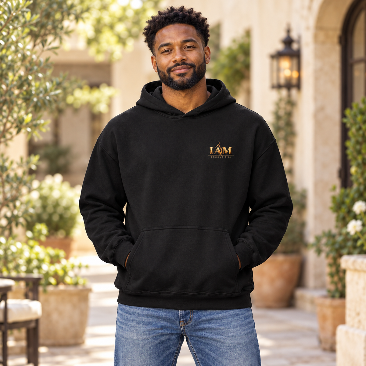 Model wearing the black I AM Exodus 3:14 hoodie, front view